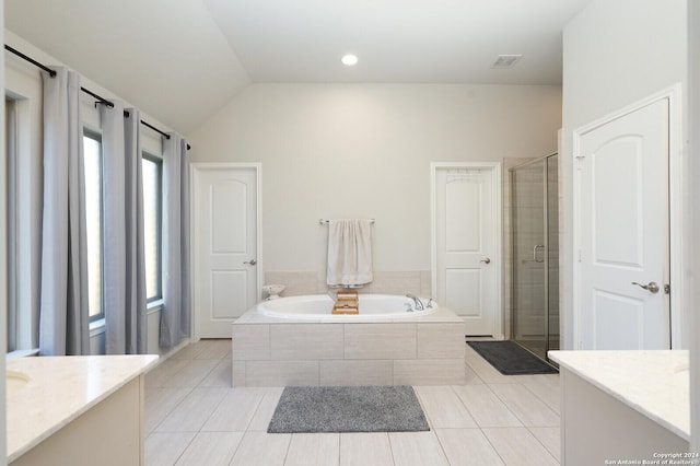 bathroom featuring tile patterned floors, vanity, vaulted ceiling, and separate shower and tub