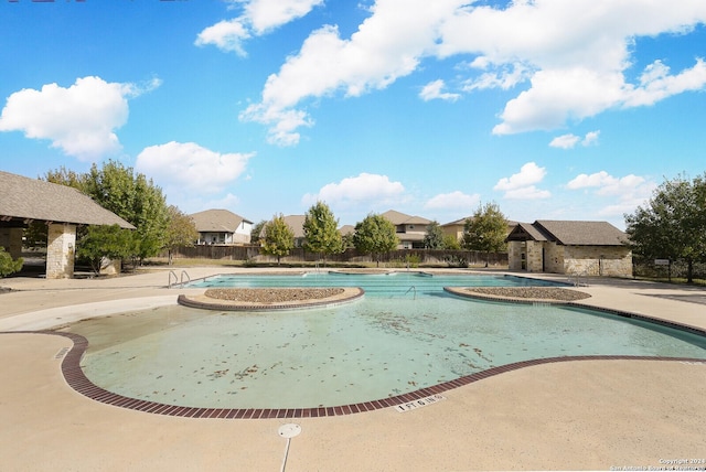 view of swimming pool featuring a patio