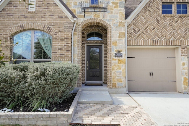 view of exterior entry with a garage