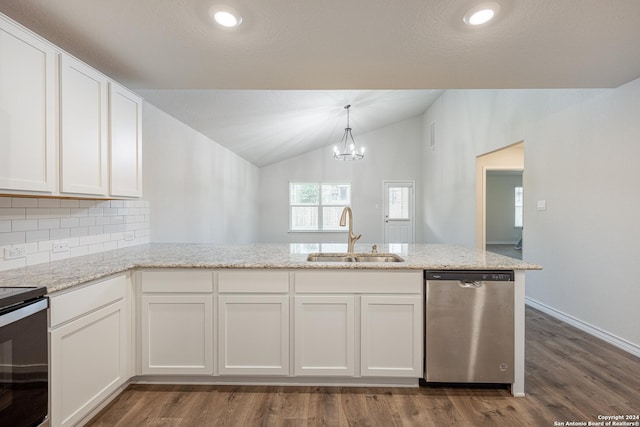 kitchen featuring hardwood / wood-style floors, lofted ceiling, white cabinets, sink, and stainless steel appliances