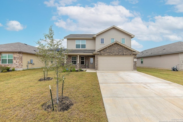 view of front of home with a garage and a front lawn