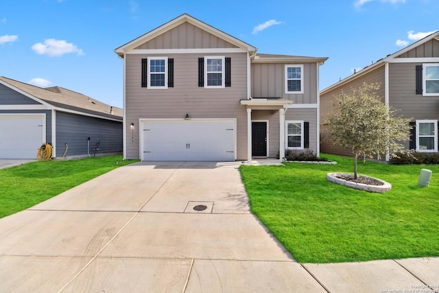 view of front of property with a garage and a front lawn