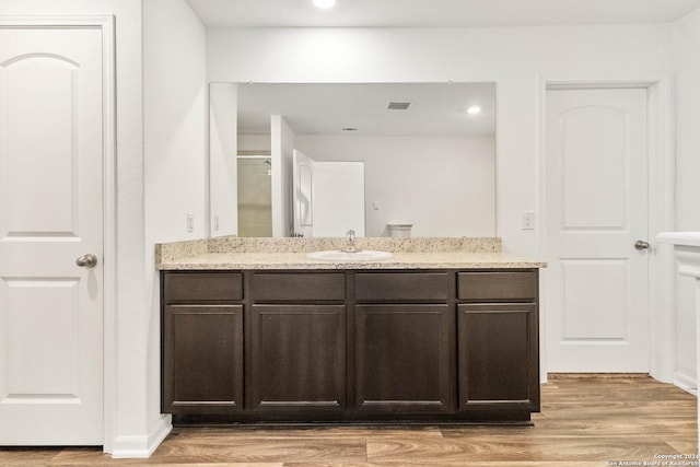 3146 Jackson Smt, Converse, TX 78109 - full bathroom featuring vanity, wood finished floors, and recessed lighting