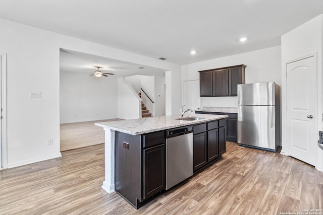 3146 Jackson Smt, Converse, TX 78109 - kitchen with appliances with stainless steel finishes, light wood-type flooring, a ceiling fan, open floor plan, and recessed lighting