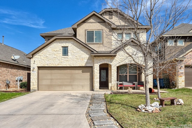 view of front of property with a garage and a front lawn