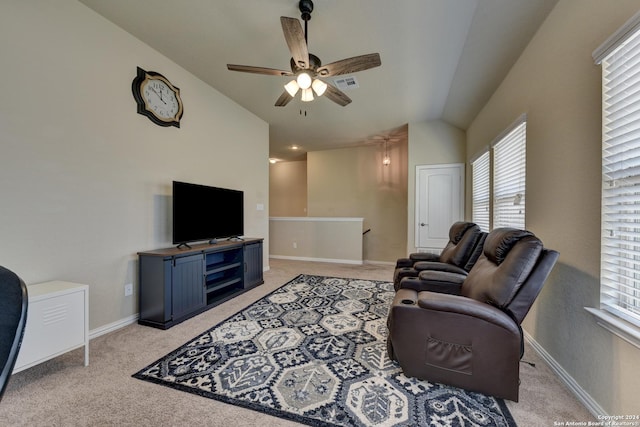 living room with ceiling fan, light carpet, and lofted ceiling