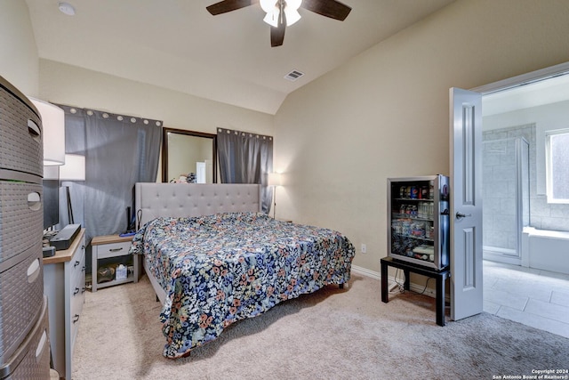 bedroom featuring ceiling fan, light carpet, and lofted ceiling