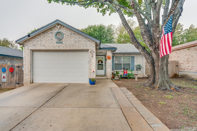 single story home featuring a garage