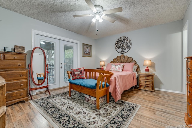 bedroom featuring access to exterior, ceiling fan, french doors, and light hardwood / wood-style floors