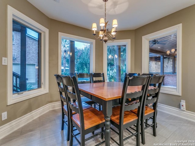 dining space with an inviting chandelier