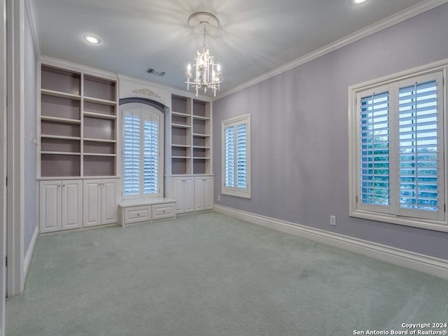 unfurnished room with ornamental molding, light carpet, and a wealth of natural light