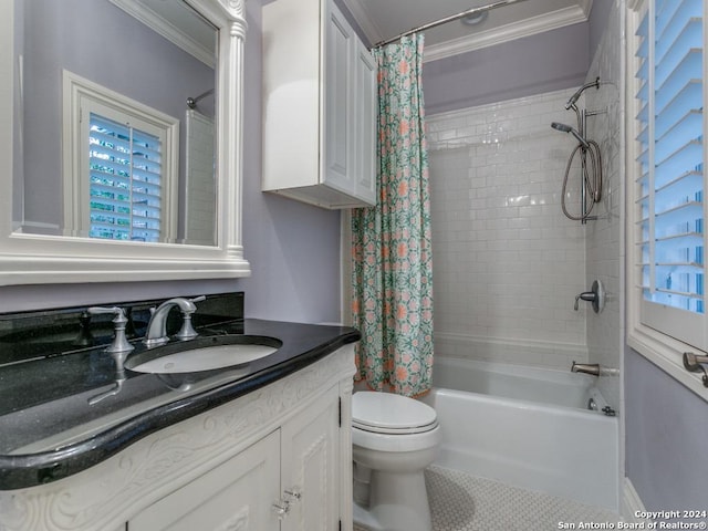 full bathroom with ornamental molding, vanity, shower / tub combo with curtain, tile patterned flooring, and toilet