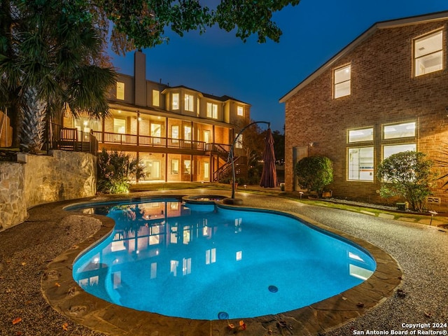 view of pool at night