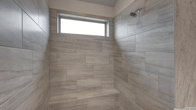 bathroom featuring tiled shower