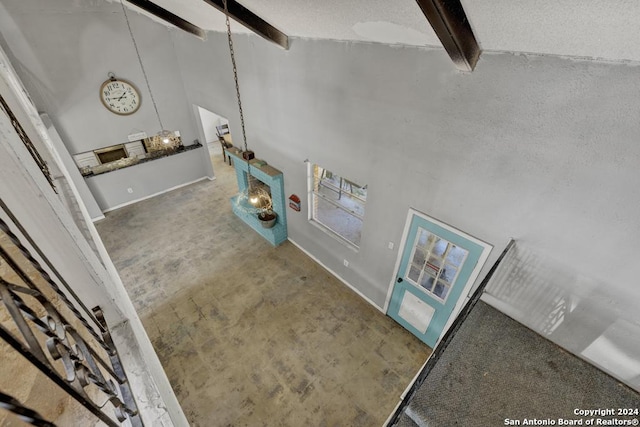 interior space featuring carpet flooring and a high ceiling