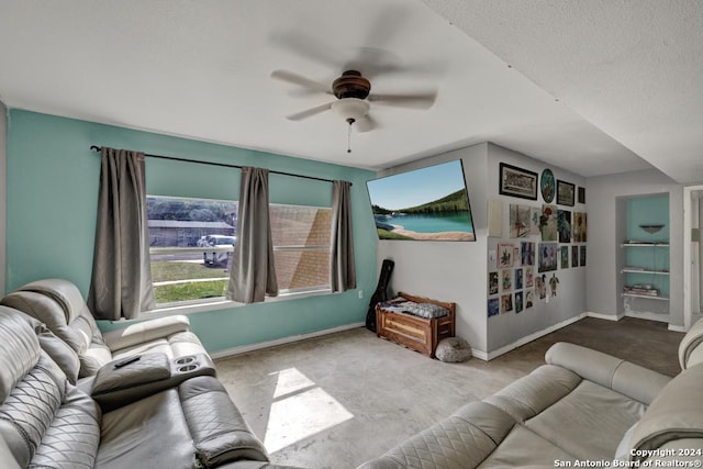 carpeted living room with ceiling fan and a textured ceiling