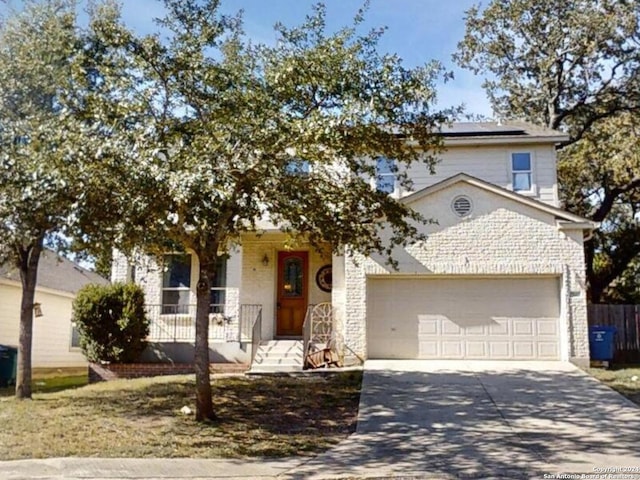 view of front of home featuring covered porch and a garage