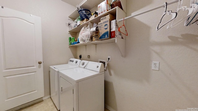 laundry room with independent washer and dryer