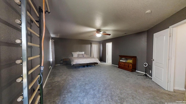 unfurnished bedroom featuring carpet flooring, ceiling fan, and a textured ceiling