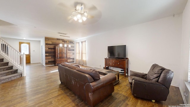 living room with ceiling fan, plenty of natural light, and hardwood / wood-style flooring