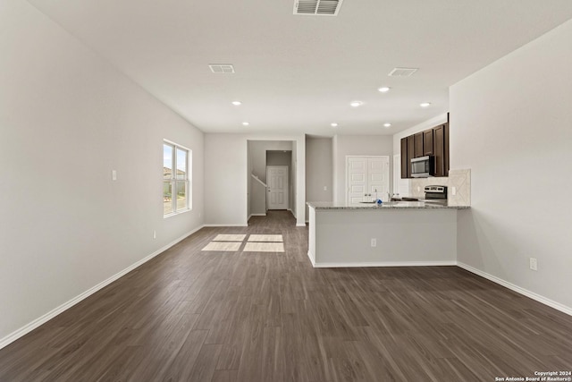 unfurnished living room with dark wood-type flooring