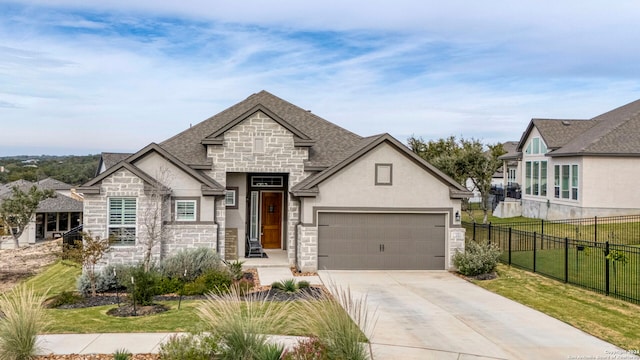 view of front of property with a front lawn and a garage