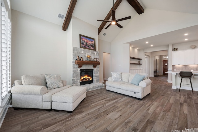 living room featuring a fireplace, dark hardwood / wood-style floors, and beamed ceiling