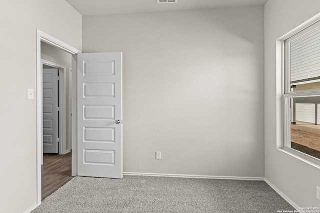 unfurnished bedroom with carpet flooring