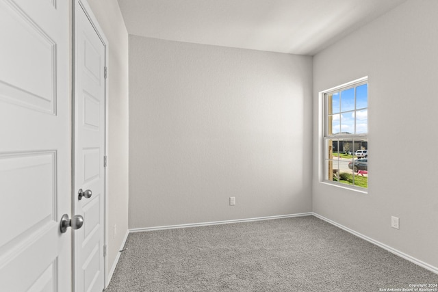 unfurnished bedroom featuring a closet and carpet floors