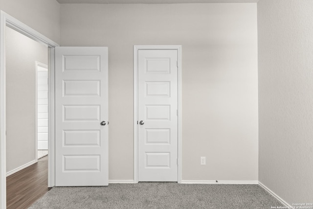 unfurnished bedroom with carpet flooring