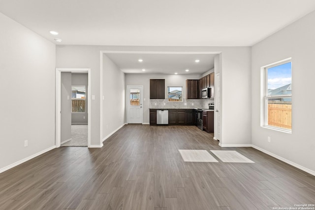 unfurnished living room featuring hardwood / wood-style floors