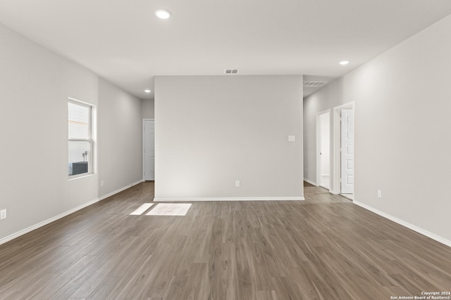 unfurnished room featuring dark wood-type flooring