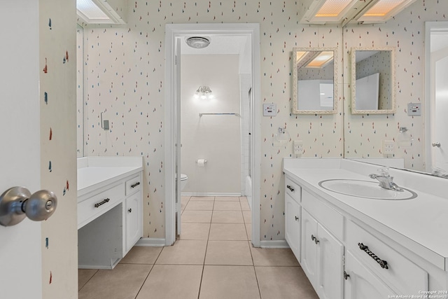 bathroom featuring tile patterned flooring, vanity, and toilet