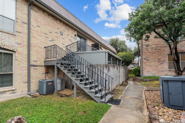 view of side of property with central AC