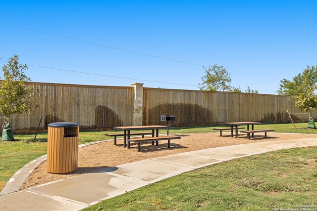 view of property's community featuring a lawn