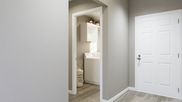 hall with light hardwood / wood-style floors