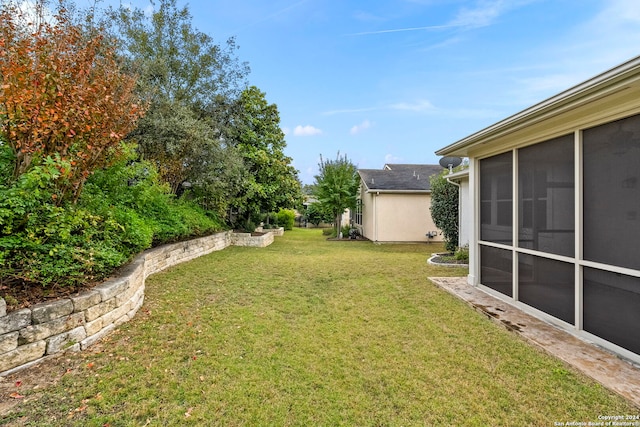 view of yard with a sunroom