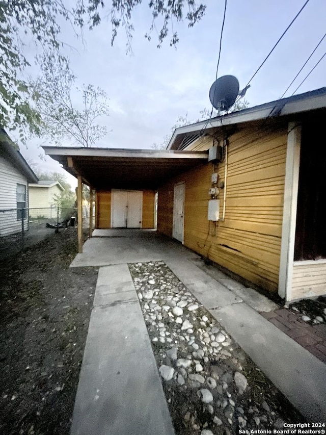 exterior space featuring a carport