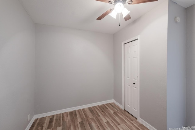 spare room featuring ceiling fan and light wood-type flooring