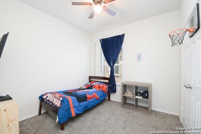 carpeted bedroom featuring ceiling fan