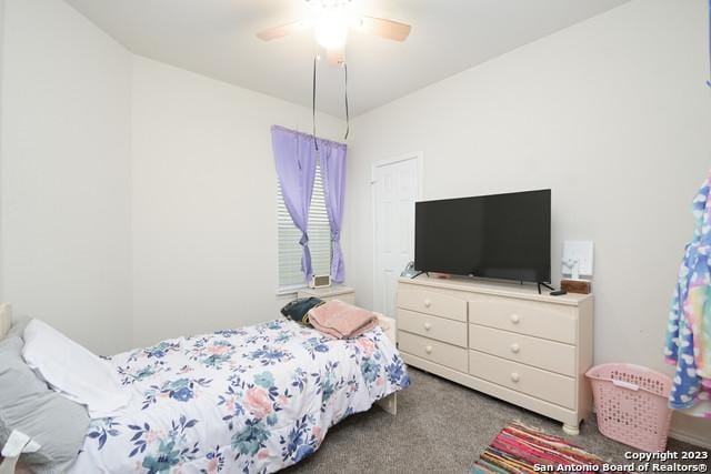 carpeted bedroom with ceiling fan