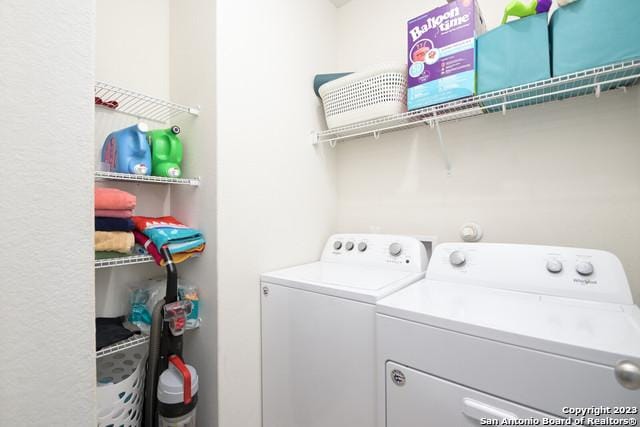 washroom with independent washer and dryer