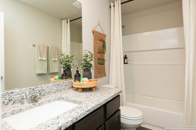 full bathroom with vanity, toilet, and shower / tub combo with curtain