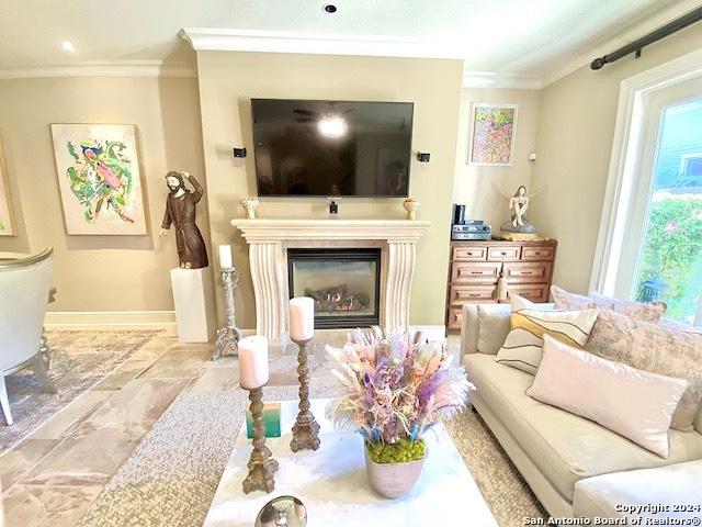 living room with ornamental molding