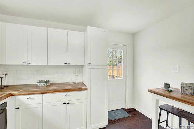 kitchen with dark hardwood / wood-style floors, white cabinetry, and butcher block counters