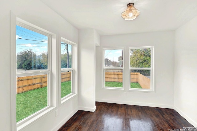 unfurnished sunroom featuring a wealth of natural light