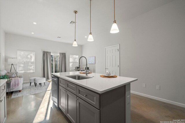 kitchen with gray cabinetry, dishwasher, sink, pendant lighting, and a center island with sink