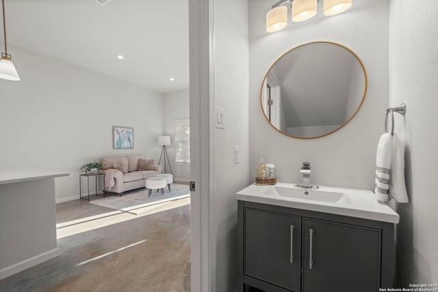 bathroom with vanity and concrete floors