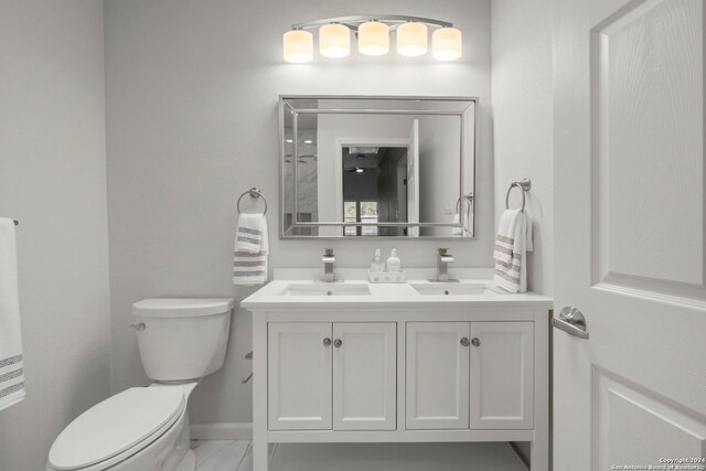 bathroom with vanity and toilet