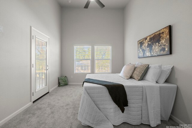 bedroom featuring ceiling fan and light colored carpet